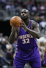 Shaquille O'Neal is taking a free throw while playig for the Phoenix Suns.