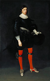 Painting of young man wearing 17th-century dress consisting of bright red hose and a black doublet, holding a black hat and white gloves in his left hand