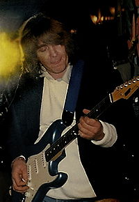 Mick Taylor-and guitar.jpg