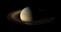 Saturn, its rings, and a few of its moons.jpg