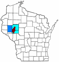 Mapa de Wisconsin con el Área Estadística Metropolitana Combinada de Eau Claire-Menomonie (CSA), compuesta por el área metropolitana de Eau Claire en celeste y el área micropolitana de Menomonie en azul.