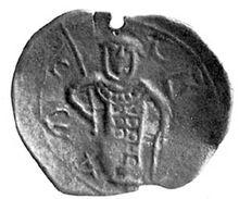 Photograph of an imperfectly-shaped medieval coin carrying the image of a man with a helmet, armour and spear