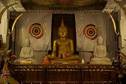 Buddha Statue, Temple of the Tooth Relic, Kandy, Sri Lanka.jpg