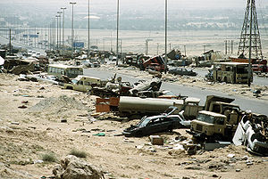 Demolished vehicles line Highway 80 on 18 Apr 1991.jpg