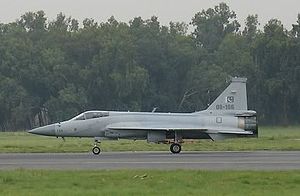 Side view of JF-17 taxiing with trucks in background cropped version.jpg